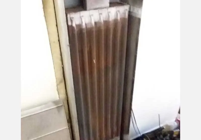 Removed 1960s wall heater with no parts identification