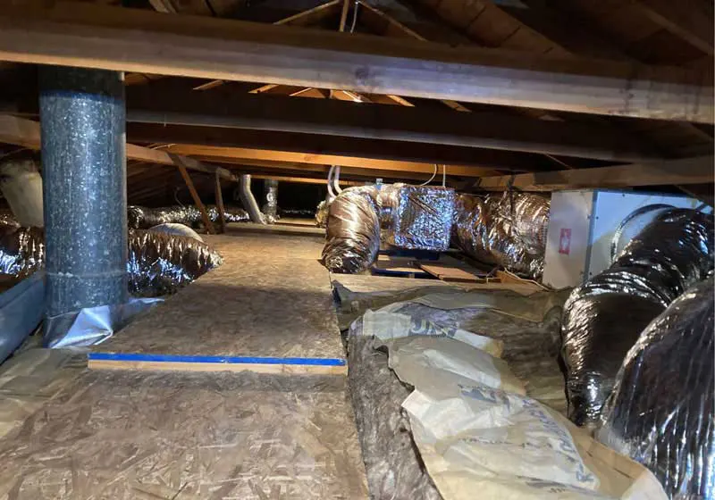 Newly fabricated attic ductwork serving the 2-zone heat pump