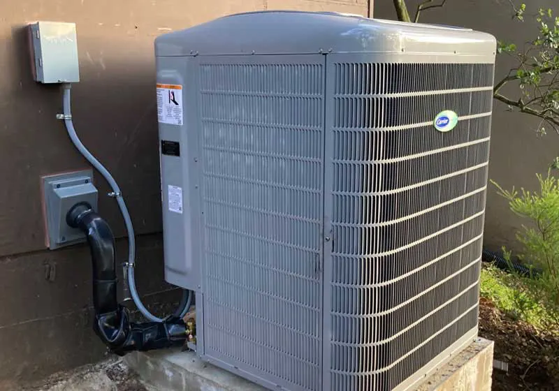 Carrier outdoor AC condenser installed in Oakland, CA